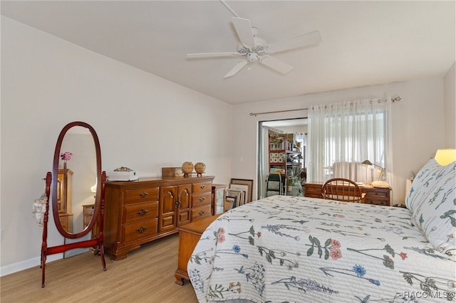 bedroom with light hardwood / wood-style floors and ceiling fan