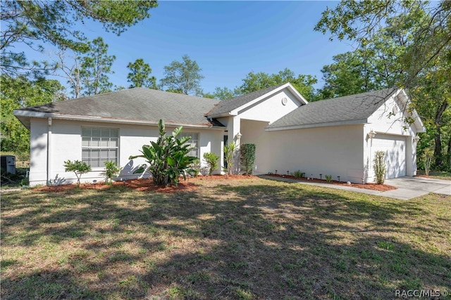 ranch-style house with a garage and a front lawn