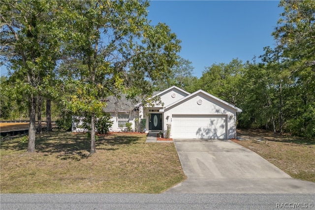 view of front of house with a garage and a front lawn