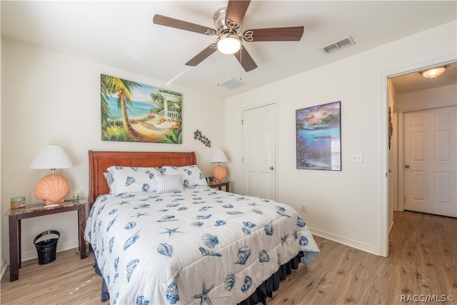 bedroom featuring light hardwood / wood-style floors and ceiling fan