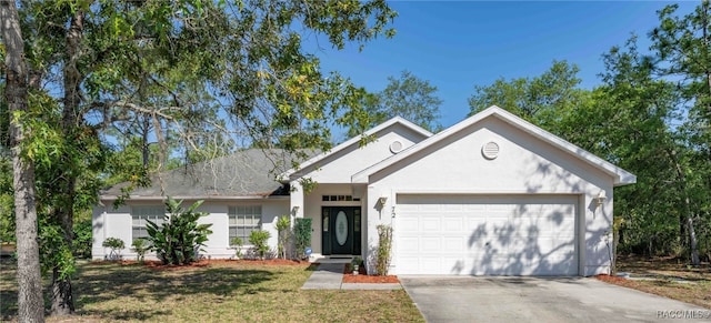 view of front of home with a garage and a front yard