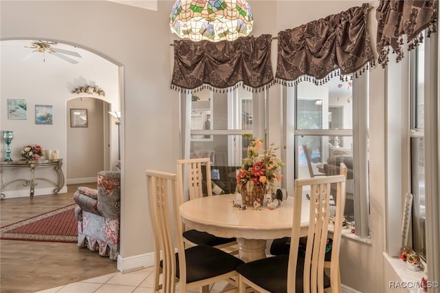 dining area featuring ceiling fan and light tile patterned flooring