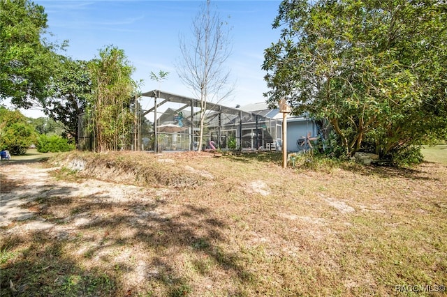 view of yard featuring a lanai