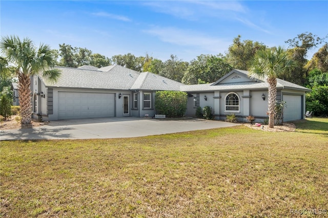 ranch-style house featuring a garage and a front lawn