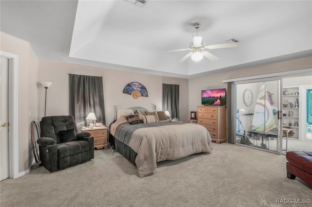 carpeted bedroom with access to outside and ceiling fan