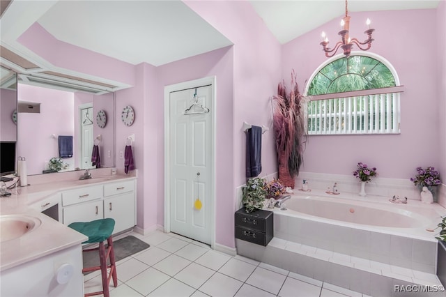 bathroom featuring vanity, tile patterned floors, vaulted ceiling, tiled tub, and a chandelier