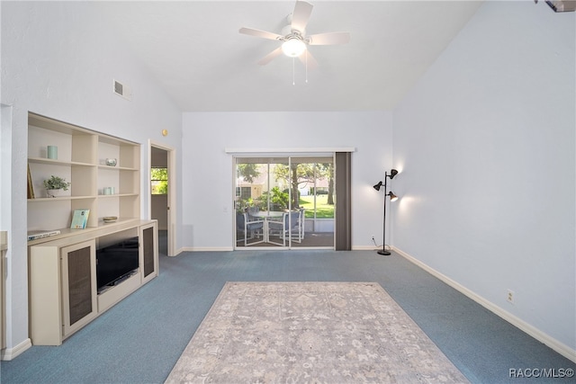 unfurnished living room featuring ceiling fan, carpet floors, and vaulted ceiling