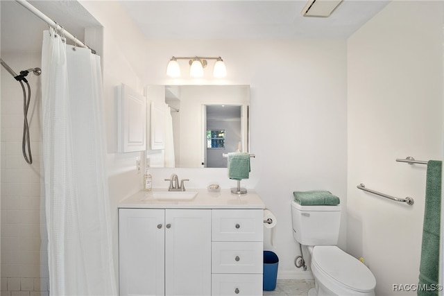 bathroom featuring walk in shower, vanity, and toilet