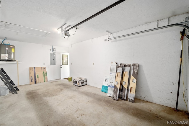 garage with a garage door opener, electric panel, and water heater