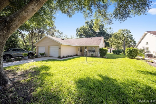 ranch-style house featuring a garage and a front yard