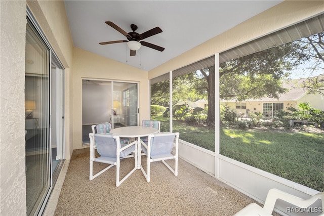 sunroom / solarium featuring ceiling fan and vaulted ceiling