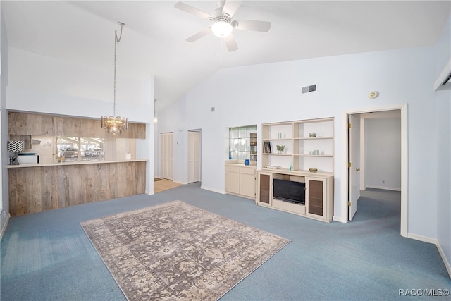 carpeted living room featuring high vaulted ceiling and ceiling fan with notable chandelier