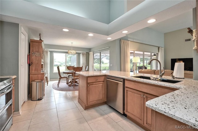 705 E Dakota Ct, Hernando, FL 34442 - kitchen with appliances with stainless steel finishes, a sink, recessed lighting, light stone counters, and hanging light fixtures