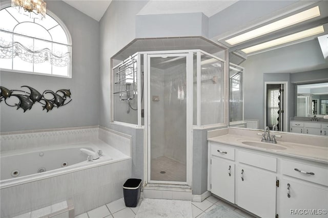 705 E Dakota Ct, Hernando, FL 34442 - bathroom featuring a stall shower, lofted ceiling, vanity, a whirlpool tub, and tile patterned floors