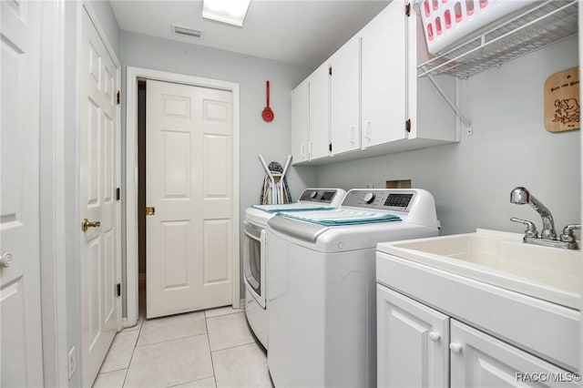 705 E Dakota Ct, Hernando, FL 34442 - washroom featuring washer and dryer, cabinet space, and light tile patterned floors