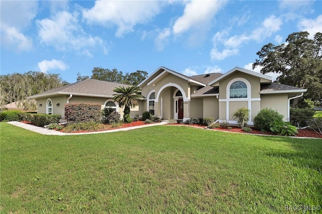 705 E Dakota Ct, Hernando, FL 34442 - single story home featuring stucco siding and a front lawn