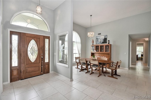 705 E Dakota Ct, Hernando, FL 34442 - entryway with plenty of natural light, light tile patterned floors, and a chandelier