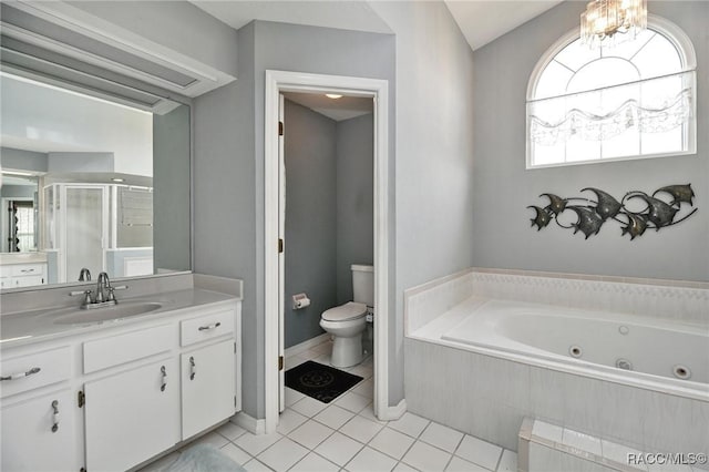 705 E Dakota Ct, Hernando, FL 34442 - bathroom with toilet, vanity, a whirlpool tub, a stall shower, and tile patterned floors