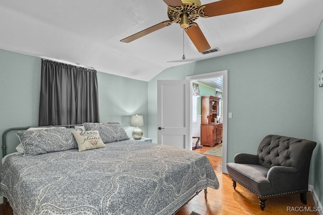 bedroom featuring wood-type flooring, ceiling fan, and lofted ceiling