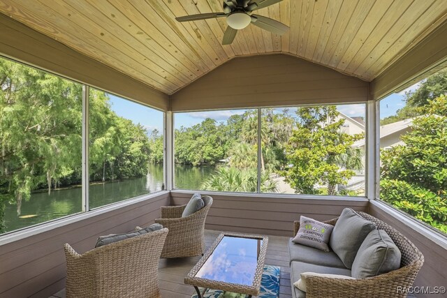 sunroom / solarium featuring ceiling fan, a water view, wooden ceiling, and vaulted ceiling