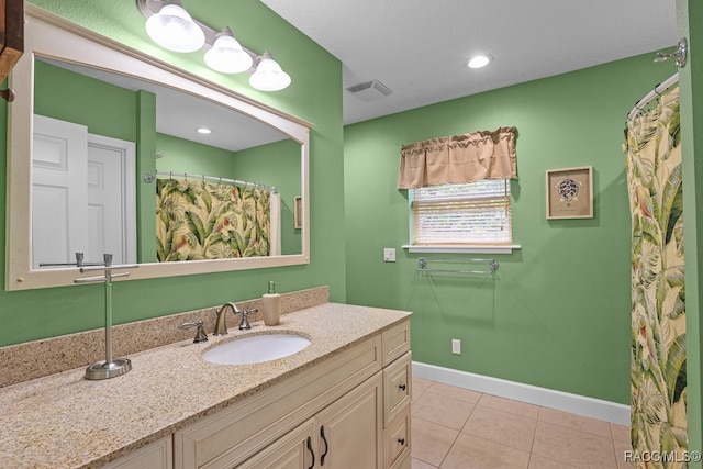 bathroom with vanity and tile patterned floors