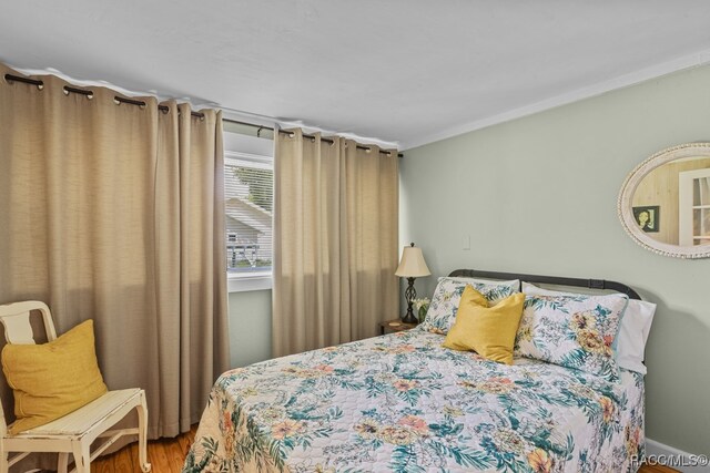 bedroom featuring hardwood / wood-style flooring