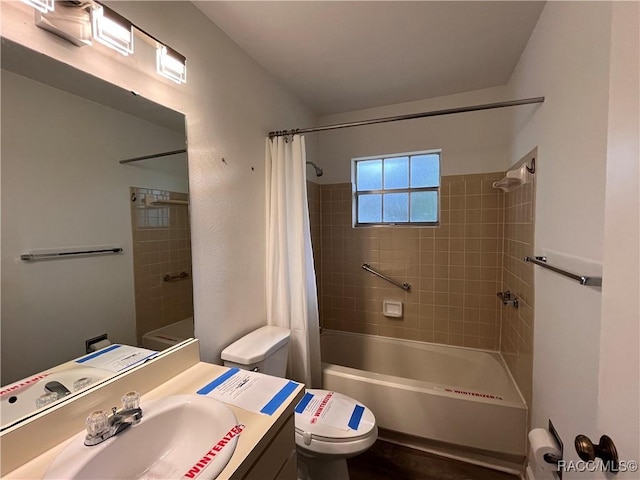 full bathroom with shower / tub combo, vanity, and toilet