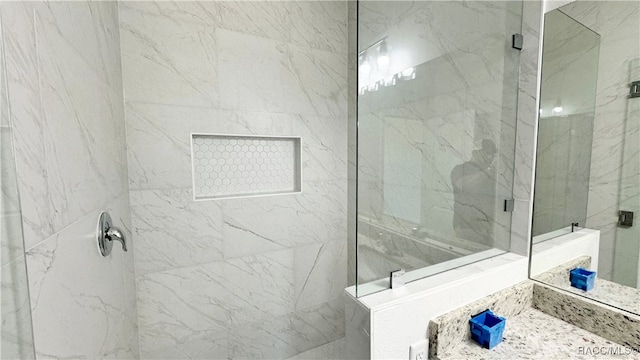 bathroom with a shower with shower door