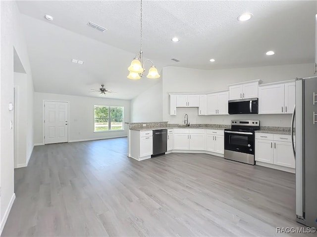 22777 SW Beach Blvd, Dunnellon, FL 34431 - kitchen featuring appliances with stainless steel finishes, vaulted ceiling, a sink, a chandelier, and open floor plan