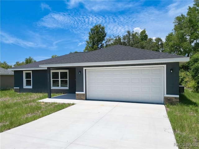 22777 SW Beach Blvd, Dunnellon, FL 34431 - ranch-style home with a garage, driveway, roof with shingles, and stone siding