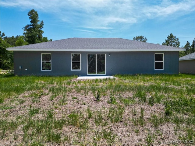22777 SW Beach Blvd, Dunnellon, FL 34431 - rear view of property with stucco siding