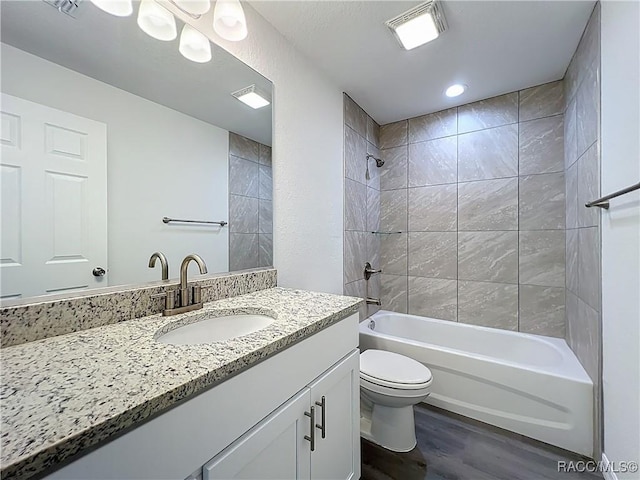 22777 SW Beach Blvd, Dunnellon, FL 34431 - bathroom featuring wood finished floors, vanity, toilet, and shower / washtub combination