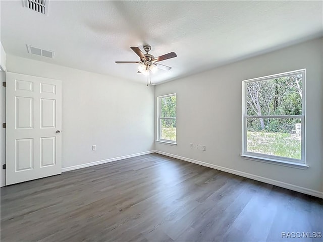 22777 SW Beach Blvd, Dunnellon, FL 34431 - empty room featuring dark wood finished floors, baseboards, and ceiling fan