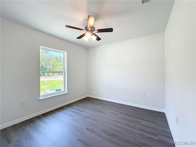 22777 SW Beach Blvd, Dunnellon, FL 34431 - unfurnished room with ceiling fan, dark wood finished floors, and baseboards