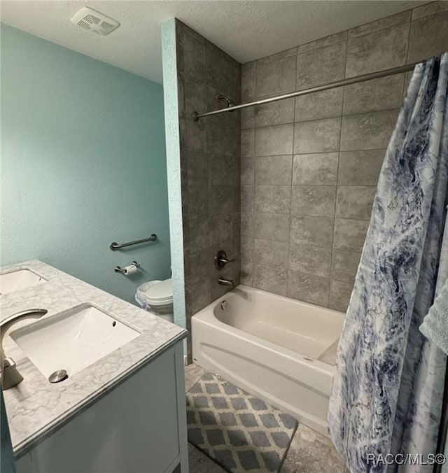 9616 E Gospel Island Rd, Inverness, FL 34450 - full bath with shower / bath combo, double vanity, a textured ceiling, and toilet