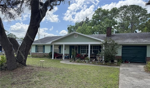 9616 E Gospel Island Rd, Inverness, FL 34450 - single story home featuring brick siding, a porch, a front lawn, a garage, and driveway