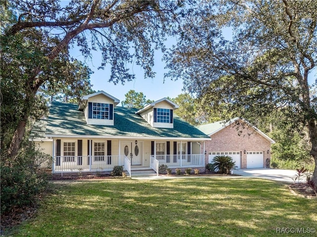 view of front of home featuring a porch, a garage, and a front yard