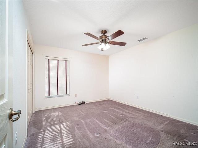 carpeted empty room with ceiling fan