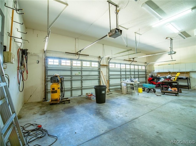 garage featuring a garage door opener