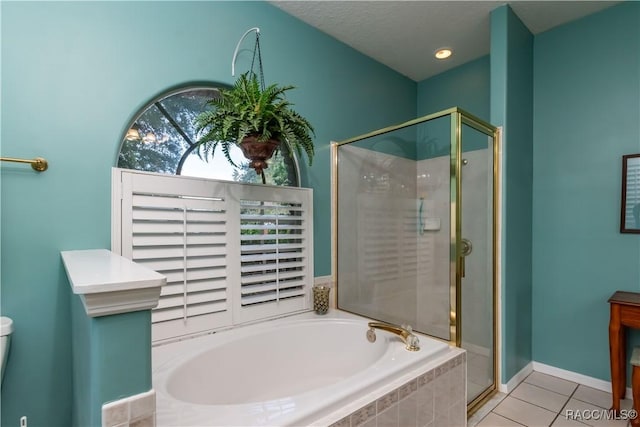 61 E Falconry Ct, Hernando, FL 34442 - bathroom with a bath, a stall shower, and tile patterned flooring