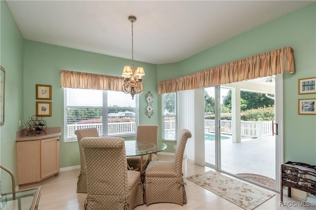 61 E Falconry Ct, Hernando, FL 34442 - dining area with a chandelier and light wood-style floors