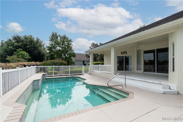 view of swimming pool featuring ceiling fan and a patio