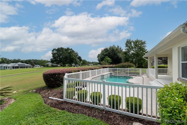 view of swimming pool with a lawn and a patio area