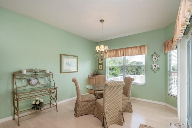 61 E Falconry Ct, Hernando, FL 34442 - dining space with light wood-style flooring and a chandelier