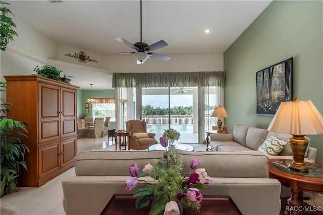 carpeted living room featuring ceiling fan