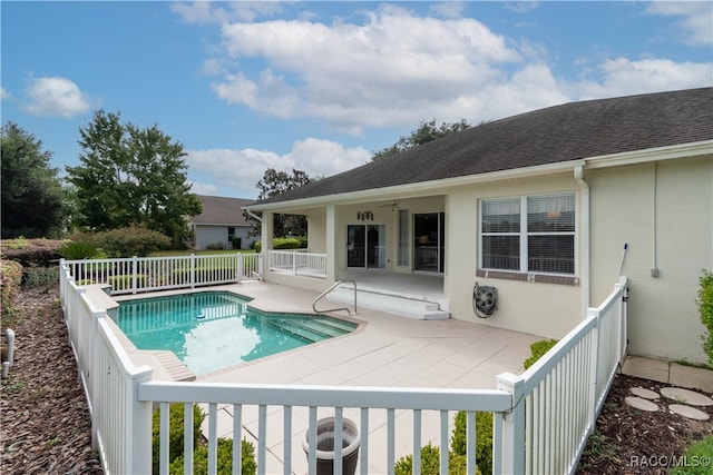 view of pool featuring ceiling fan and a patio area