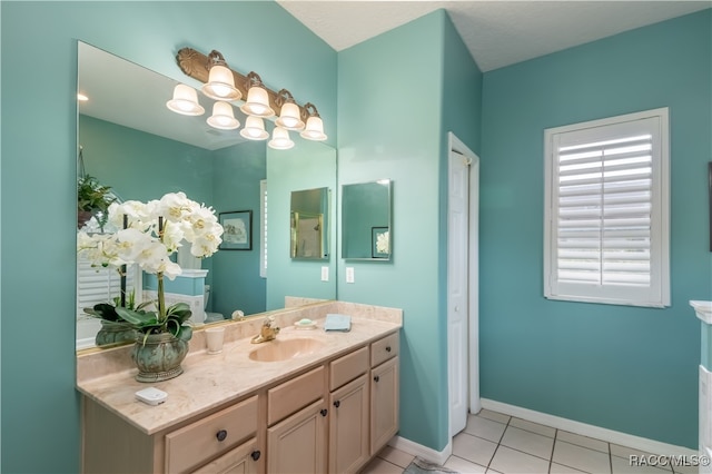 bathroom with tile patterned floors and vanity