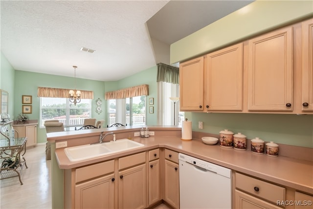 kitchen with kitchen peninsula, sink, light hardwood / wood-style flooring, dishwasher, and a chandelier