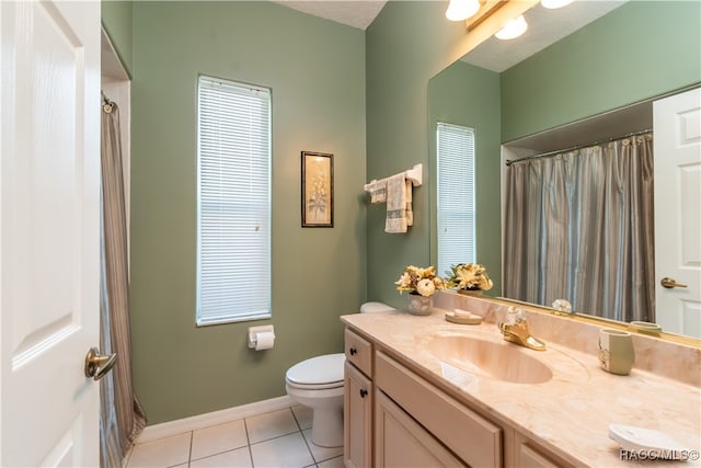 bathroom with tile patterned flooring, vanity, a shower with shower curtain, and toilet