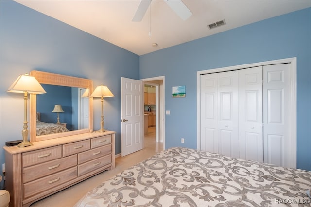 bedroom featuring ceiling fan and a closet